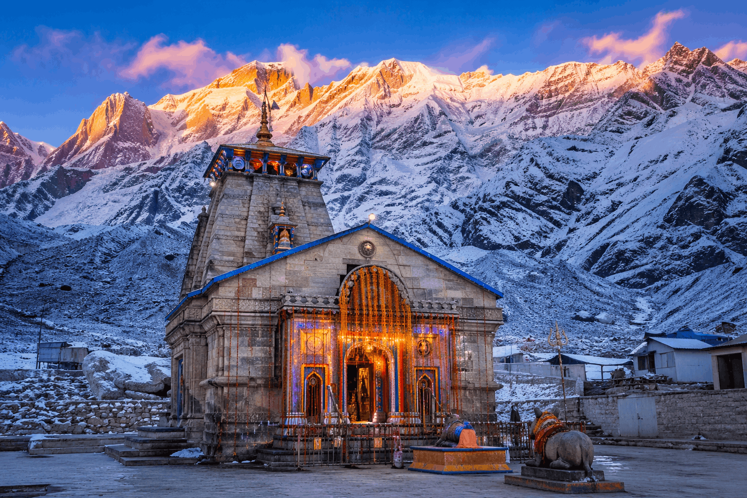 Kedarnath Temple scenic view with snow-covered Himalayas and sunrise sky